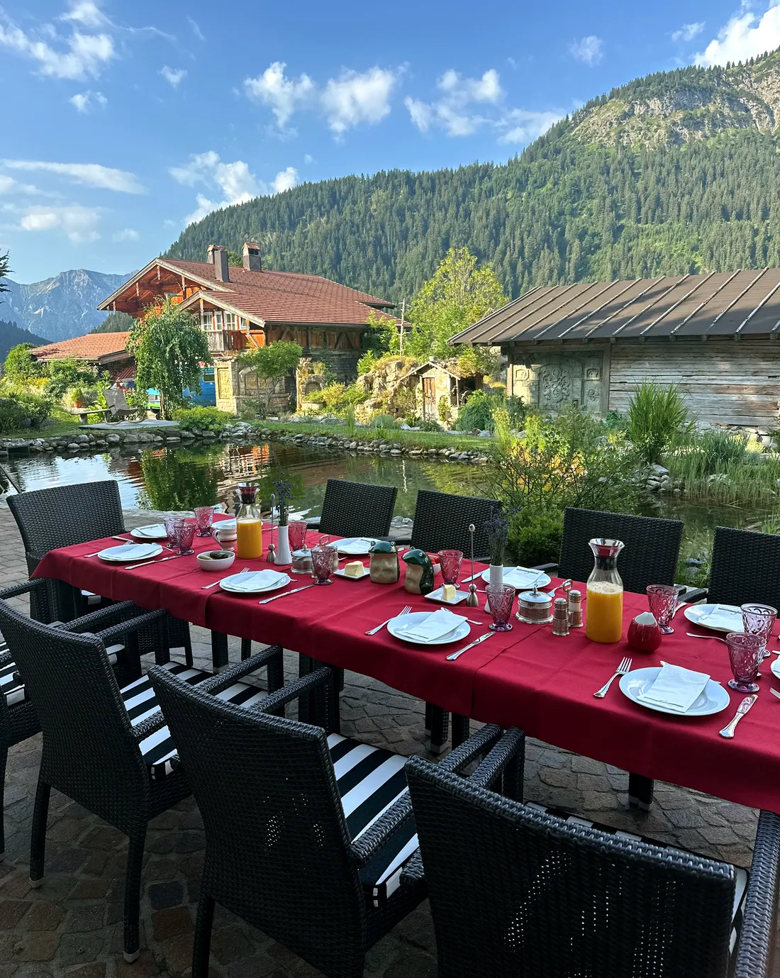 Breakfast laid on the terrace of the Sunneschlössli with a view of the Tannheimer mountains